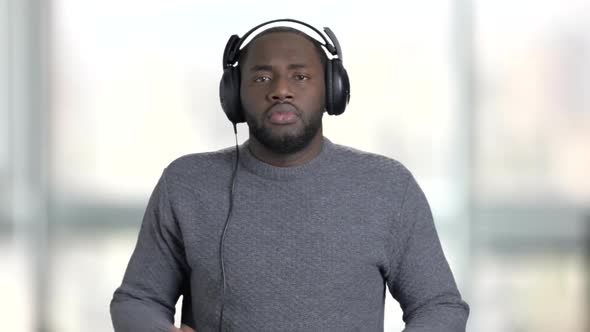 Portrait of a Young Black Man Enjoying Music.