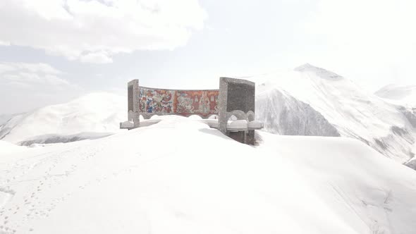 Gudauri, Georgia - April 12, 2021: Aerial view of Russia–Georgia Friendship Monument