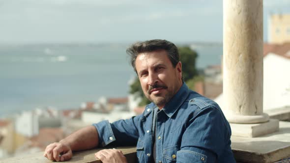 Slow Motion of Man Looking at City Landscape From View Point