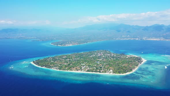 aerial seascape, tropical vacation and island hopping concept. Gilli air island and Lombok on a fogg