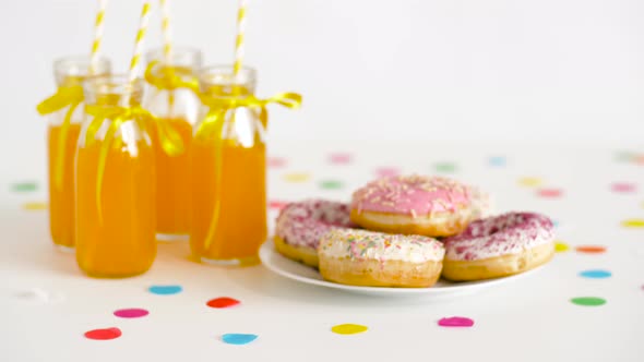 Donuts and Lemonade or Juice in Glass Bottles