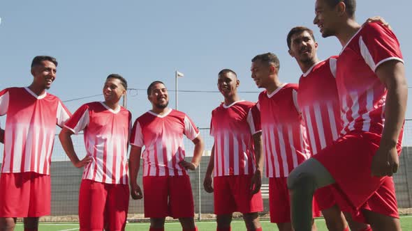 Soccer players standing on field