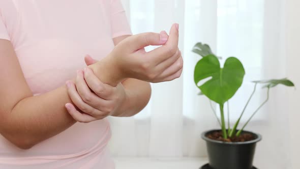 Women doing hands stretching and exercising to protect office syndrome and hand arthritis after work