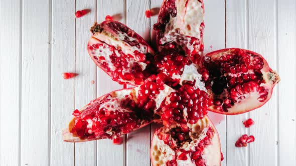 Stop Motion on Pomegranate Seeds Is Peeled in the Shape of a Heart, Randomly on the Table