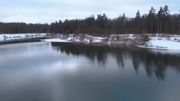 Duck is Swimming on a Winter Lake