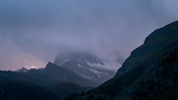 Timelapse of clouds clearing at sunset over the Matterhorn Mountain Switzerland