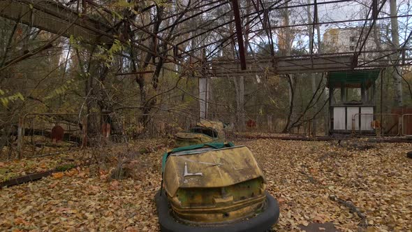 Decayed Autodrome with bumper cars in ghost town Pripyat in radioactive chernobyl exclusion zone