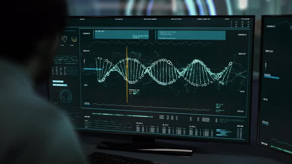 The doctor is working on the computer. The DNA strand is being analyzed. UI.