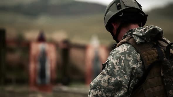 Soldier practices switching from rifle to pistol