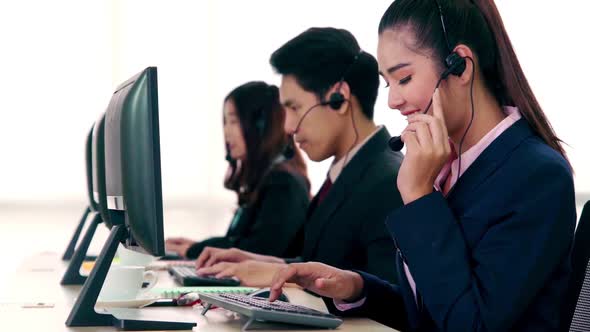 Business People Wearing Headset Working in Office