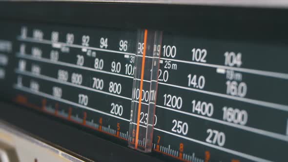 Tuning Analog Radio Dial Frequency on Scale of the Vintage Receiver