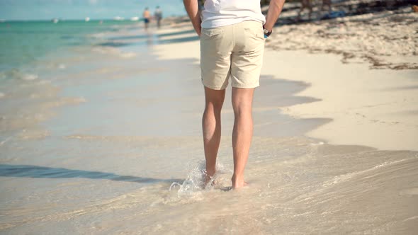 Man Legs Walking On Tropical Beach. Calm Healthy Man In Shorts Resting On Ocean Idyllic Exotic Beach