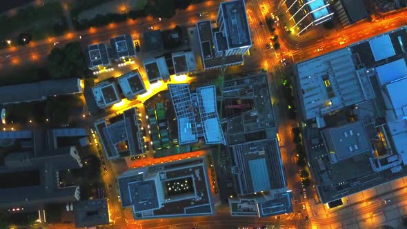 AERIAL: Birds View of Big City Construction Site at Night,City Lights, Traffic,Movement