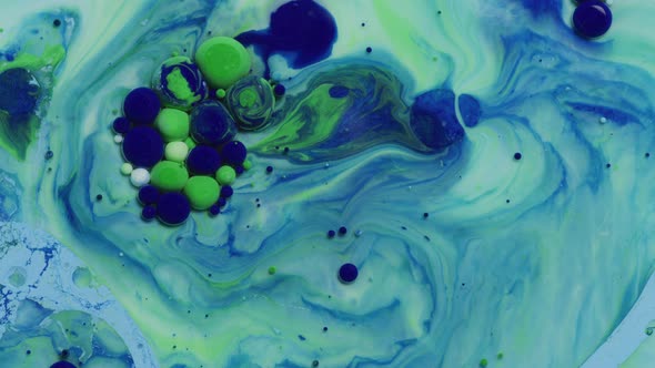 Abstract close up texture of oil with blue and green paint