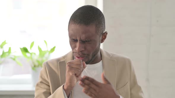 Portrait of Sick African Man Coughing