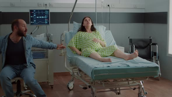 Screaming Pregnant Woman Going Into Labor in Hospital Ward