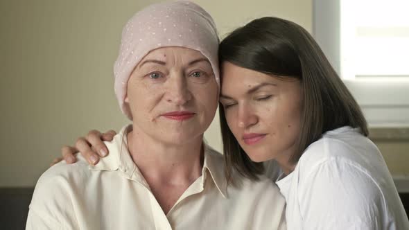 Young Woman Hugs Her Sick Mom After Chemotherapy