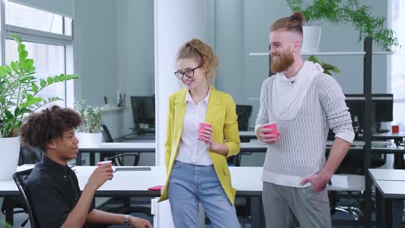 Startup Team Chatting During Coffee Break