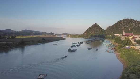 Aerial View Boats in River Bay with Bridge Against Hillpeaks