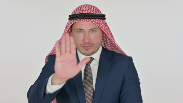 Arab Businessman Showing Stop Sign by Hand, White Background