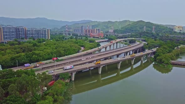 A dynamic aerial shot moving towards a highway above waters in Yuen Long in Hong Kong. Yuen Long Hig
