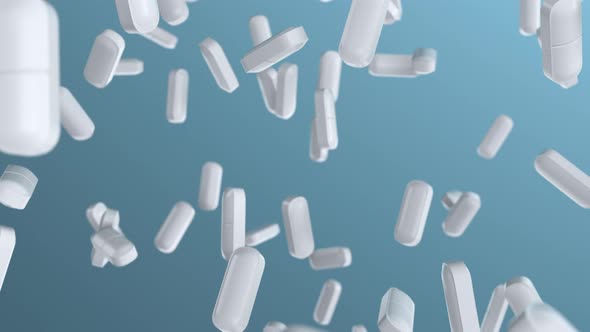 Pills and medicine tablets slowly falling on the laboratory background 4k loop