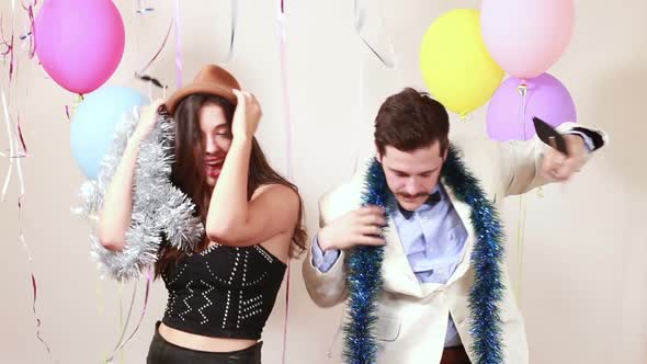 Couple in love dancing in photo booth