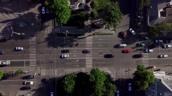 Drone's Eye View - Aerial View of the Vehicular Intersection, Fly Under Trees.