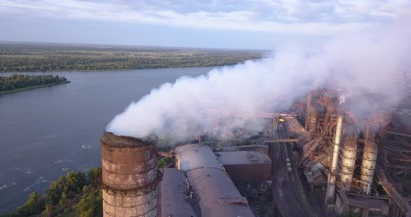 Aerial View of Industrial Zone with a Large Pipe Thick White Smoke