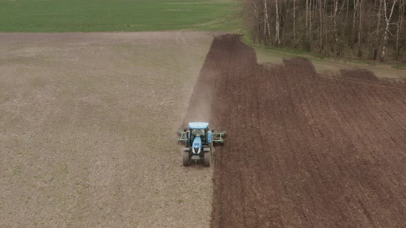 Agricultural tractor working in the field