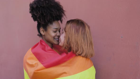 Happy gay couple celebrating pride while having romantic moment outdoor - Lgbt and love concept