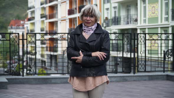 Front View Portrait Confident Beautiful Senior Slim Woman Posing Outdoors on City Street