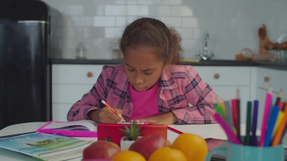 Smart Focused Black Girl Learning in Kitchen