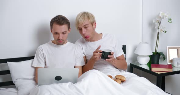 Romantic Male Gay Couple Spend Time at Home Lying on Bed