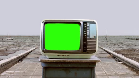 Retro TV Set with Green Screen in a Flooded Ghost Town. 4K Version.