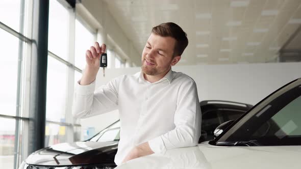 Portrait of Happy Adult Successful Man Posing in Auto Showroom Buying New Automobile