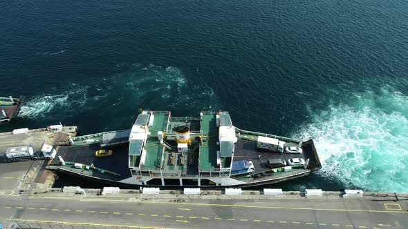 Drone View Of Vehicles Getting On The Ferry