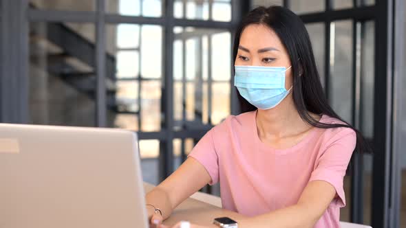 An Young Asian Woman Wearing Medical Mask Indoor