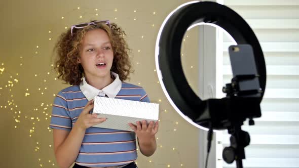 Teen Blogger Opens a Box and Records a Video for His Blog