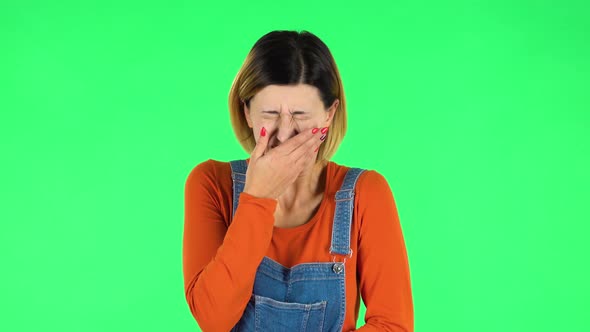 Girl Got a Cold, Sore Throat and Head, Cough on Green Screen at Studio