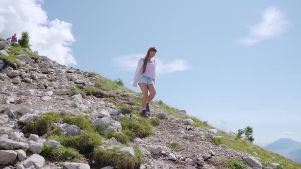 Young Girl Descends From the Rocky Mountain