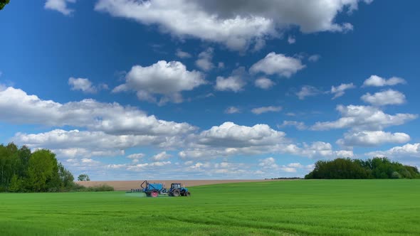 Tractor Sprays Fertilizer on the Field