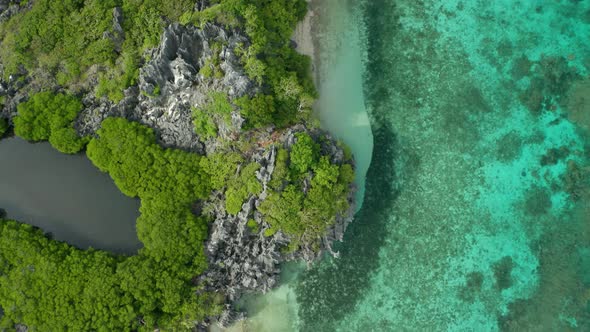 Green Lush Island Of  Fiji Composed Of Green Trees and Blue Calm Ocean - Aerial Shot