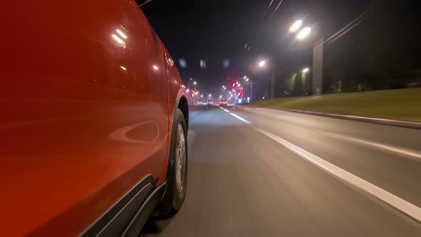 Drivelapse Urban Look From Fast Driving Car at a Night Avenue in a City Timelapse Hyperlapse