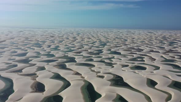 Sand dunes mountains and rain water lagoons at northeast brazilian paradise.