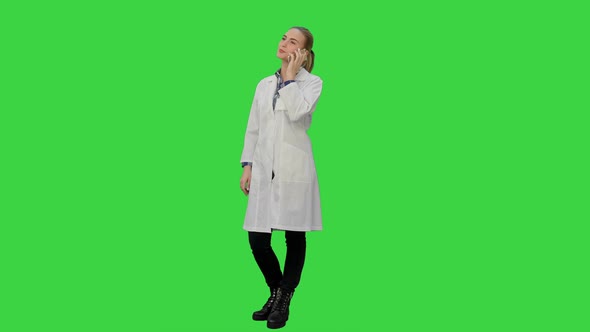 Female Doctor Talk Via Cell Phone with Patient Reporting Good News on a Green Screen, Chroma Key