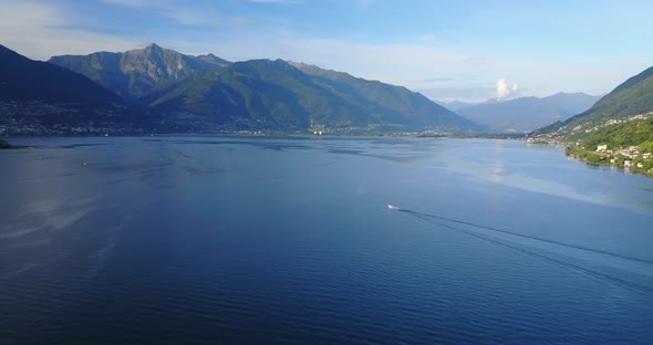 Aerial drone view of boat boating on Lake Maggiore, Switzerland.