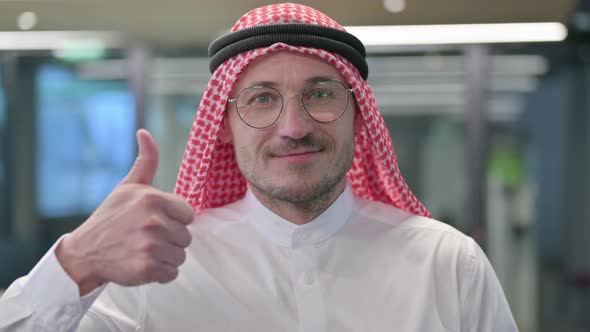 Middle Aged Arab Man showing Thumbs Up Sign
