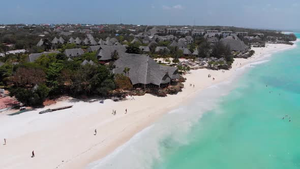 Aerial Paradise Sandy Beach with Turquoise Ocean and Luxury Hotels in Zanzibar