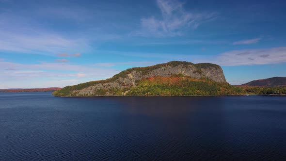 Aerial orbit around a distant Kineo mountain in autumn